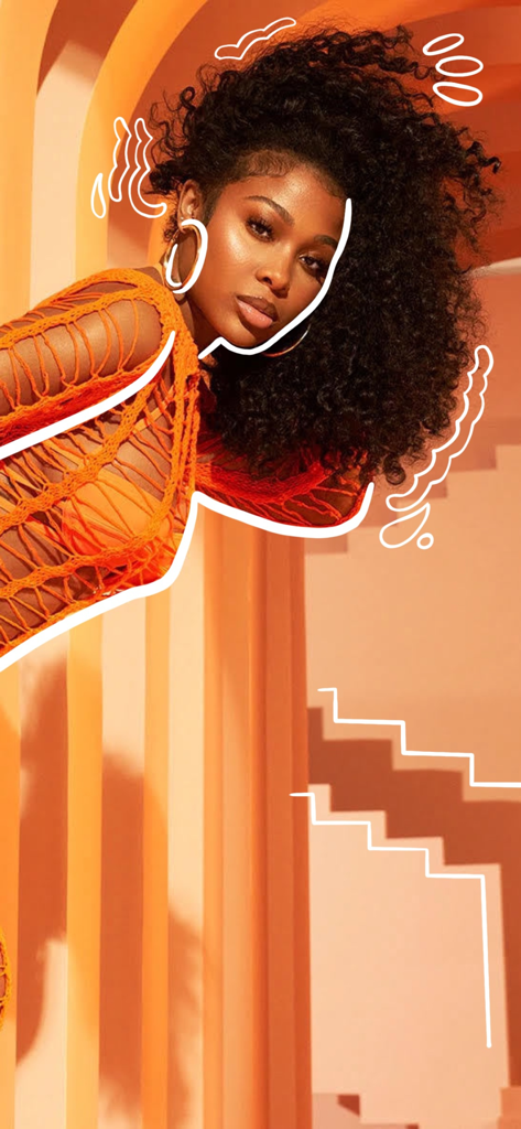 A woman with voluminous curly hair showcasing a premium wig from the Wigdealer app.