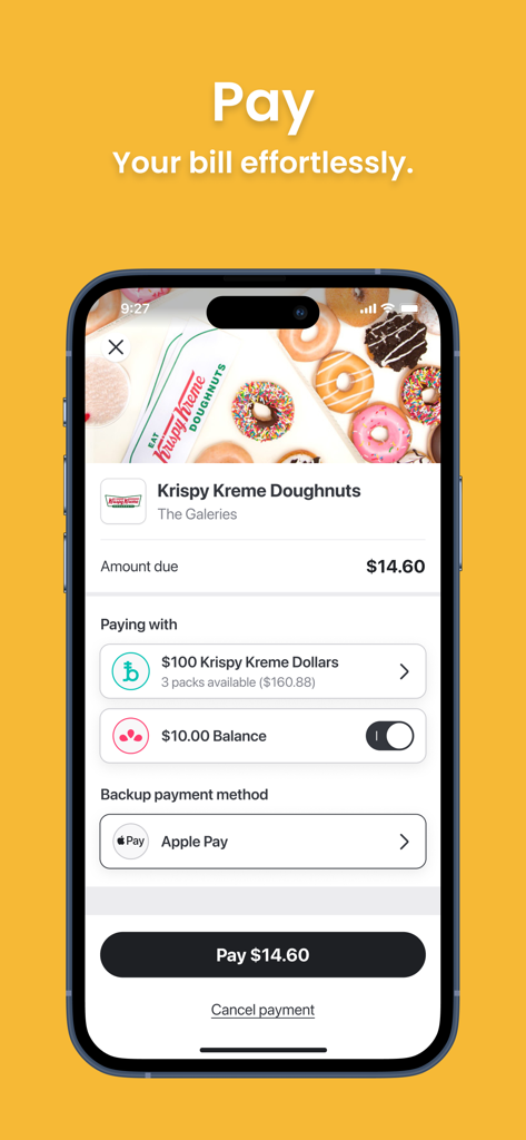 A smartphone displaying the Liven app checkout interface for a Krispy Kreme purchase using Brandollars and Apple Pay.