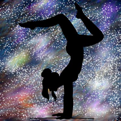 a woman doing a handstand