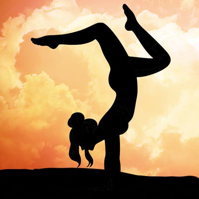 a woman doing a handstand