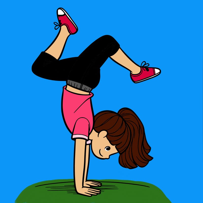 a girl doing a handstand