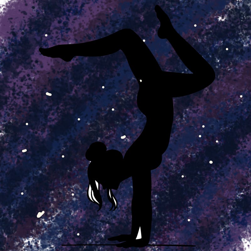a woman doing a handstand