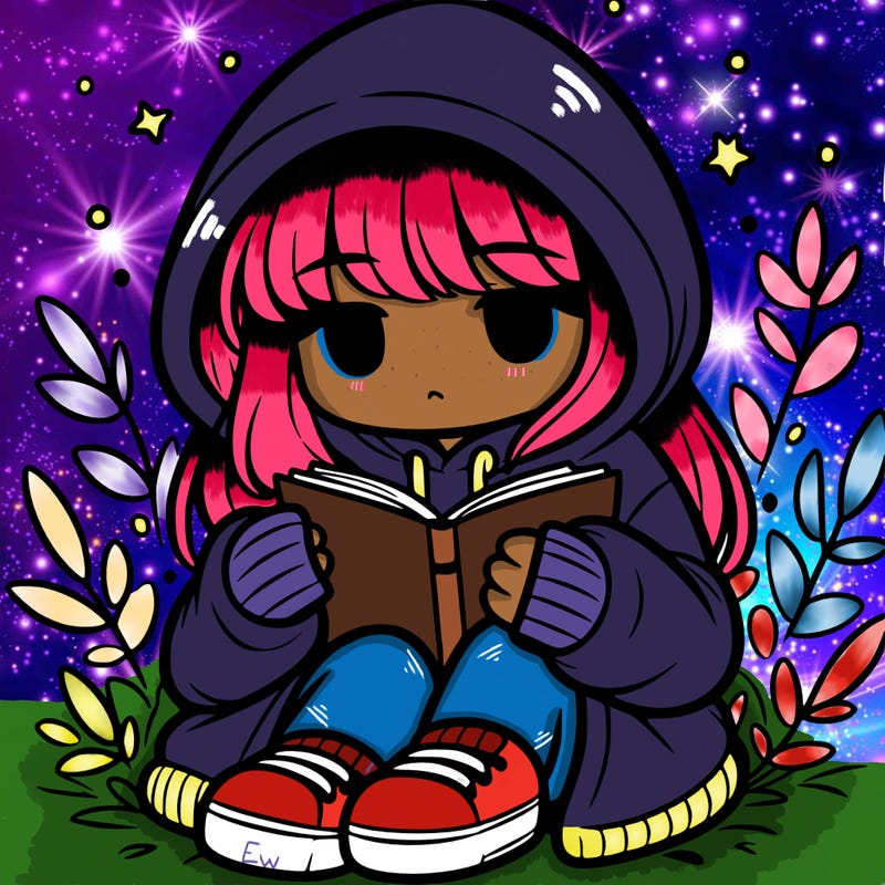 girl in oversized hoodie reading a book