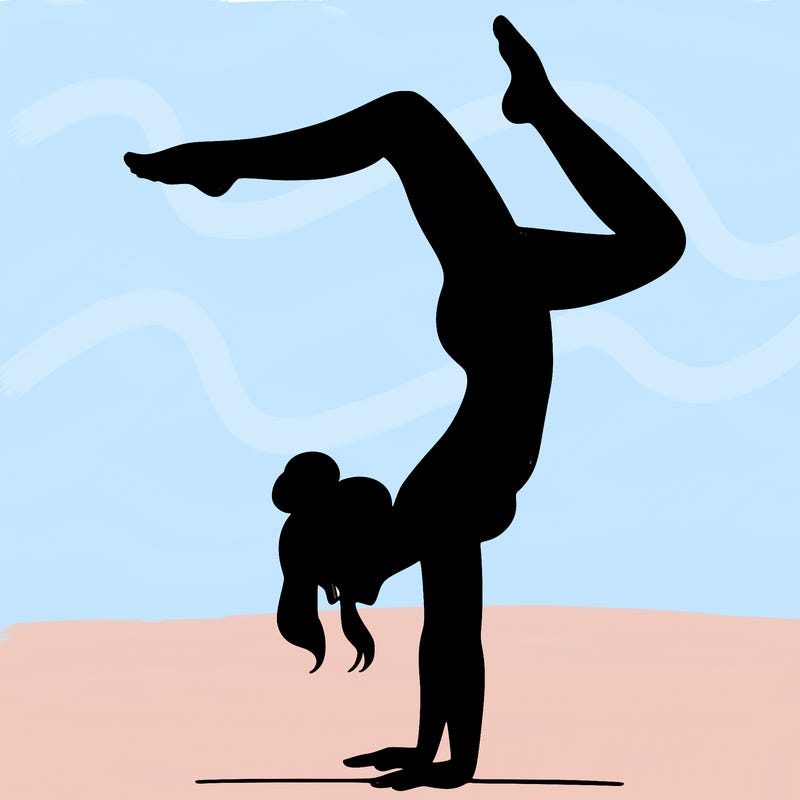a woman doing a handstand