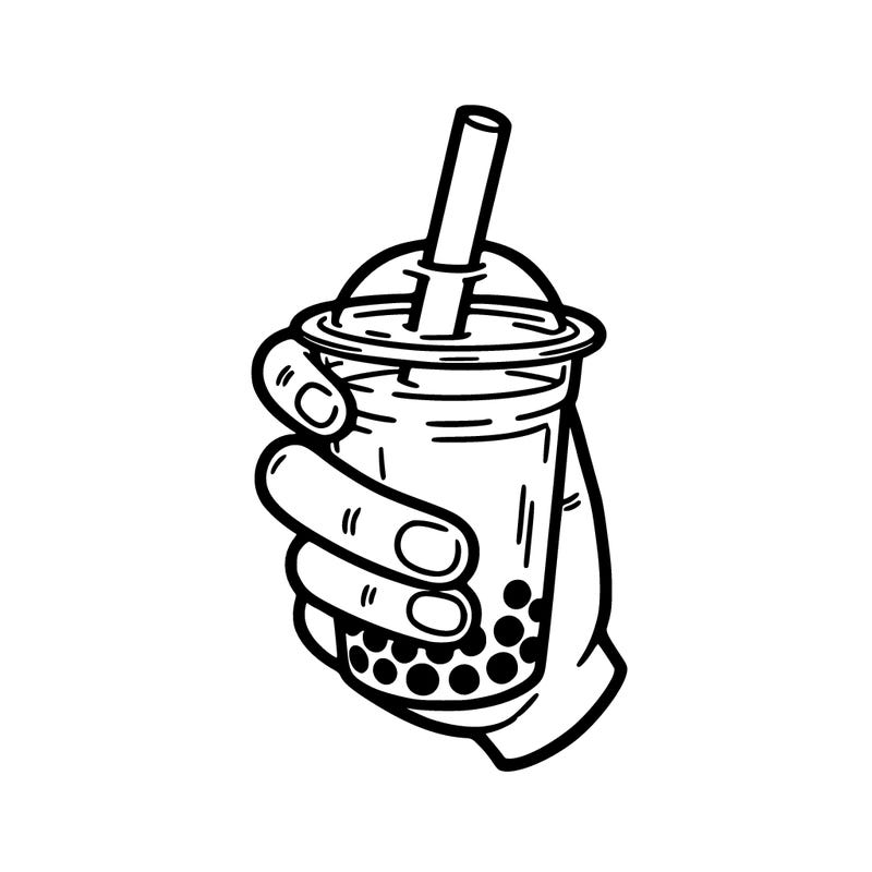 a hand holding boba tea