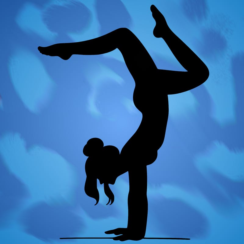 a woman doing a handstand