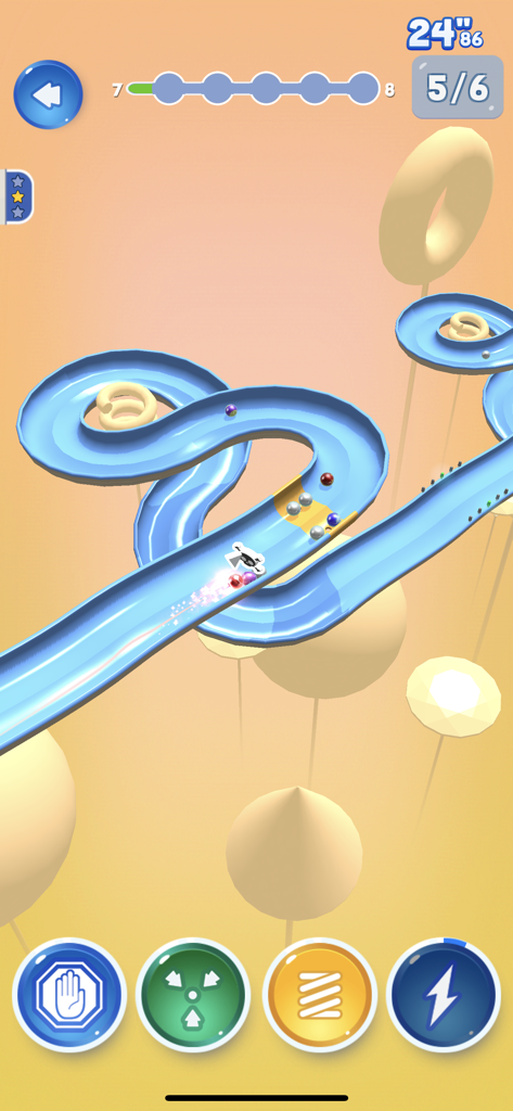 Gameplay of Marble Dream showing marbles on a blue 3D racing track with power-up icons
