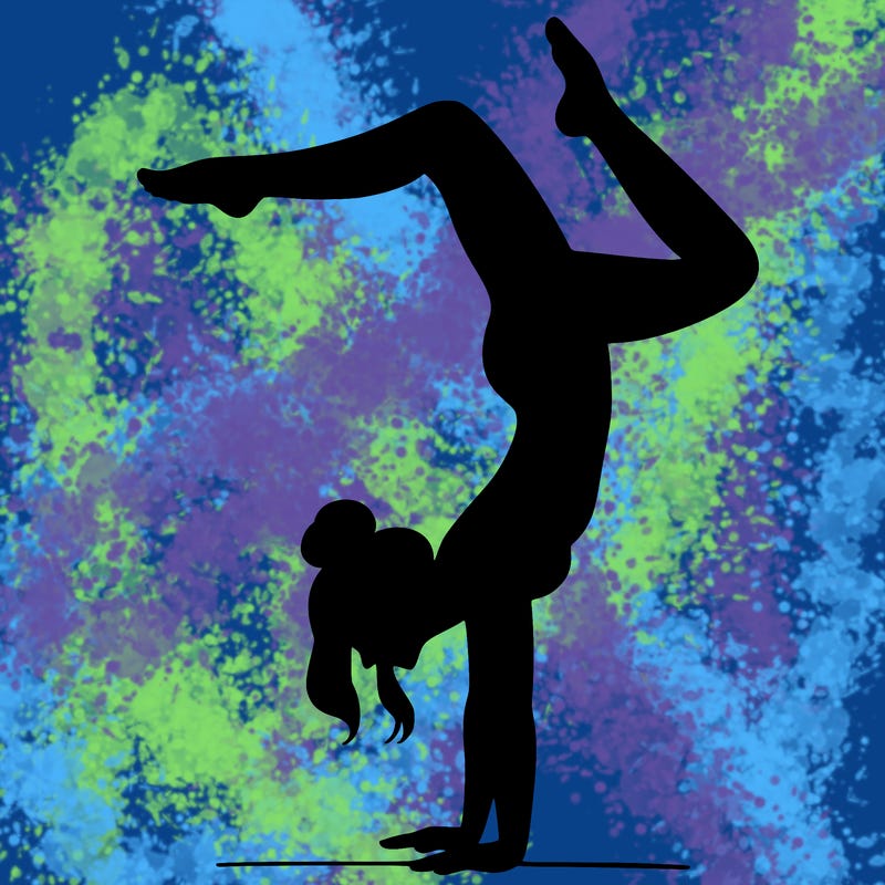 a woman doing a handstand