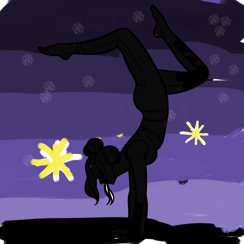 a woman doing a handstand