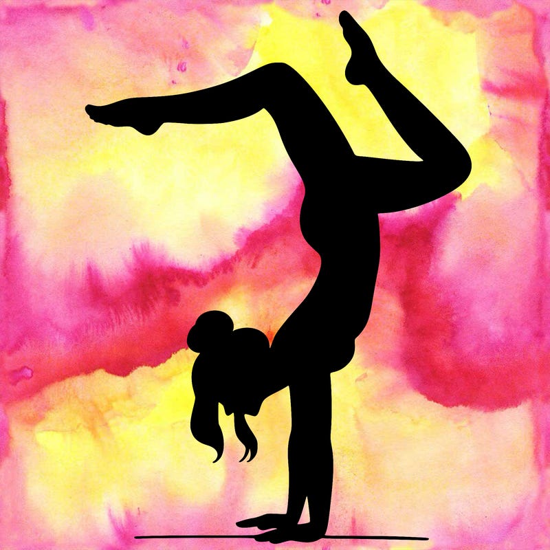 a woman doing a handstand