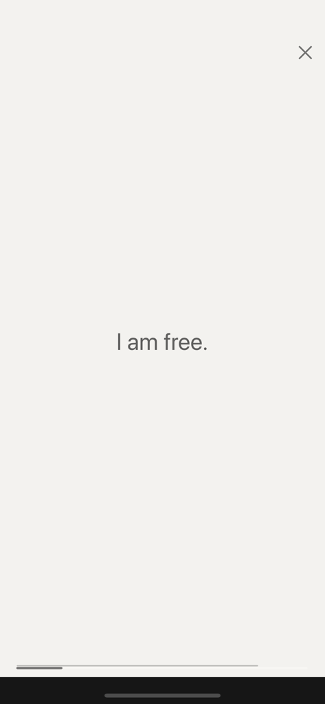 Minimalist display of a positive affirmation stating I am free on a neutral background