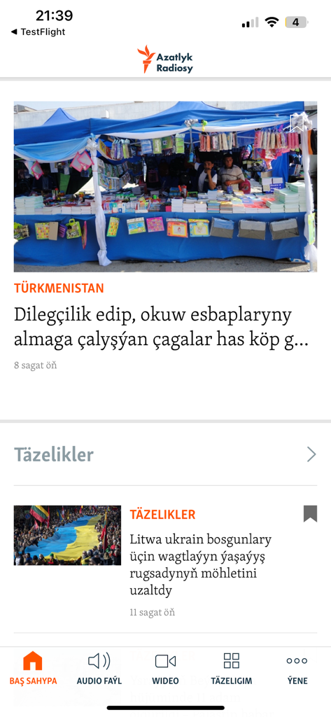Azatlyk Radiosy - Azatlyk Radiosy mobile app interface displaying news articles in the Turkmen language about local and international events.