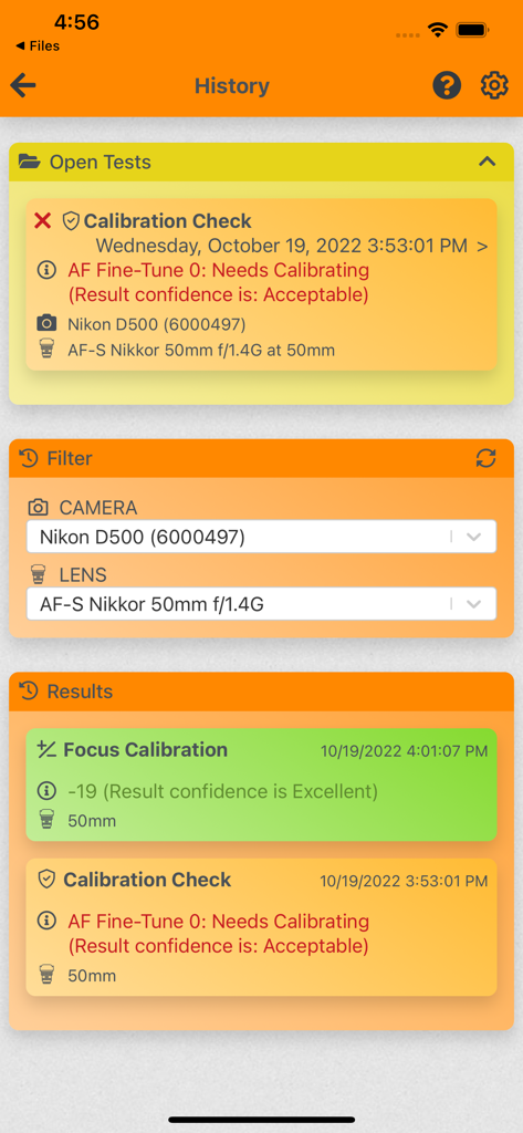 Pantalla de historial de la aplicación FoCal Mobile que muestra los resultados de calibración del enfoque para una Nikon D500 y un lente Nikkor 50 mm.