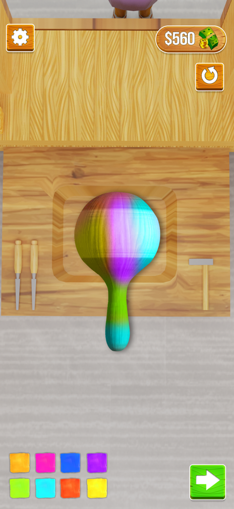 Wood Carving 3D - A rainbow-colored wooden object being painted in a wood carving 3D simulation game