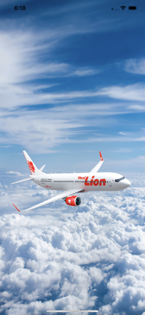 Thai Lion Air airplane flying above white clouds under a blue sky