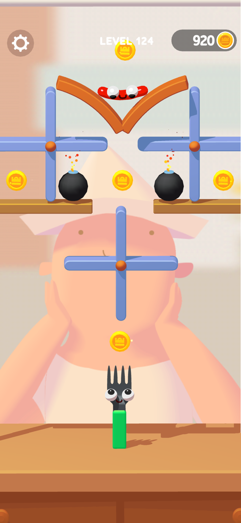 Level gameplay in Fork N Sausage showing a sausage character moving through kitchen obstacles to reach a fork.
