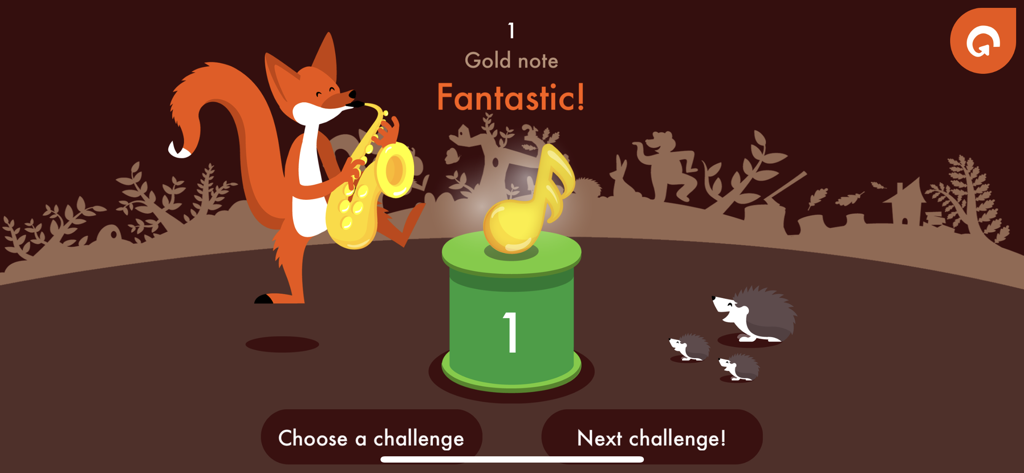 Music4Kids - A cartoon fox playing a saxophone next to a golden musical note on a reward screen for completing a musical challenge in the Music4Kids app.