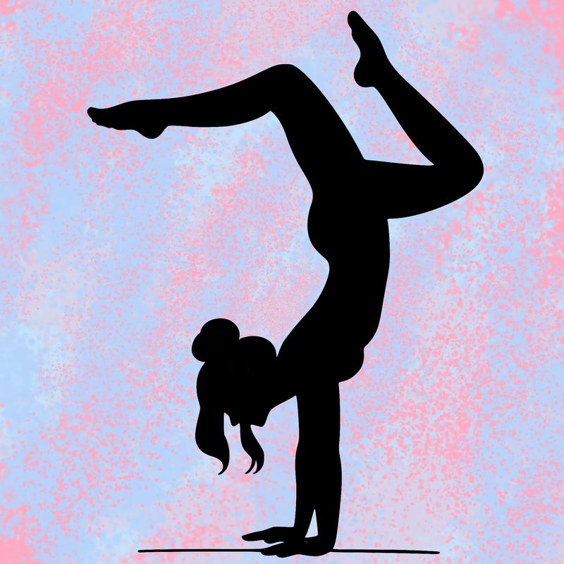 a woman doing a handstand