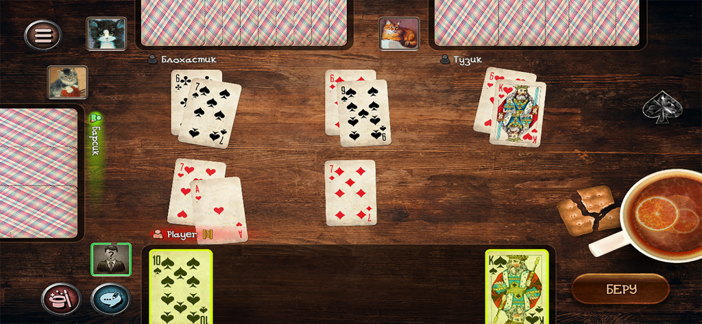 Durak game - Durak card game gameplay showing cards on a wooden table with player avatars and a cup of tea