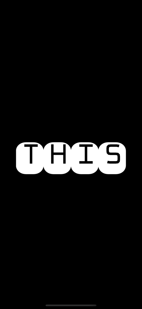 FlashText - Full screen view of FlashText app showing the word THIS in white block letters on a black background