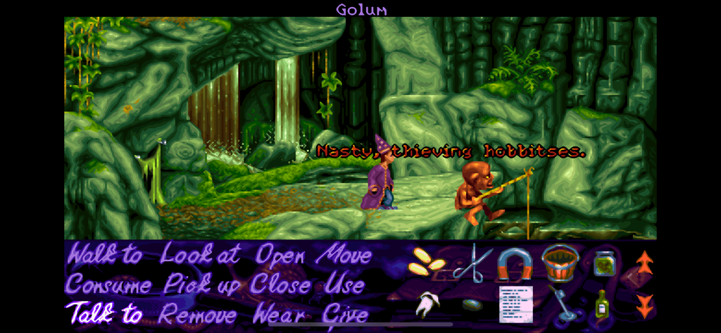 Simon the Sorcerer talking to a Golum parody character in a green cave