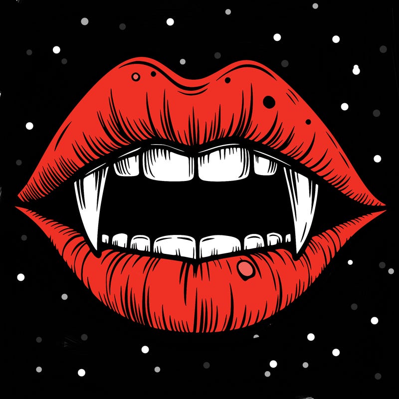 lips with vampire teeth