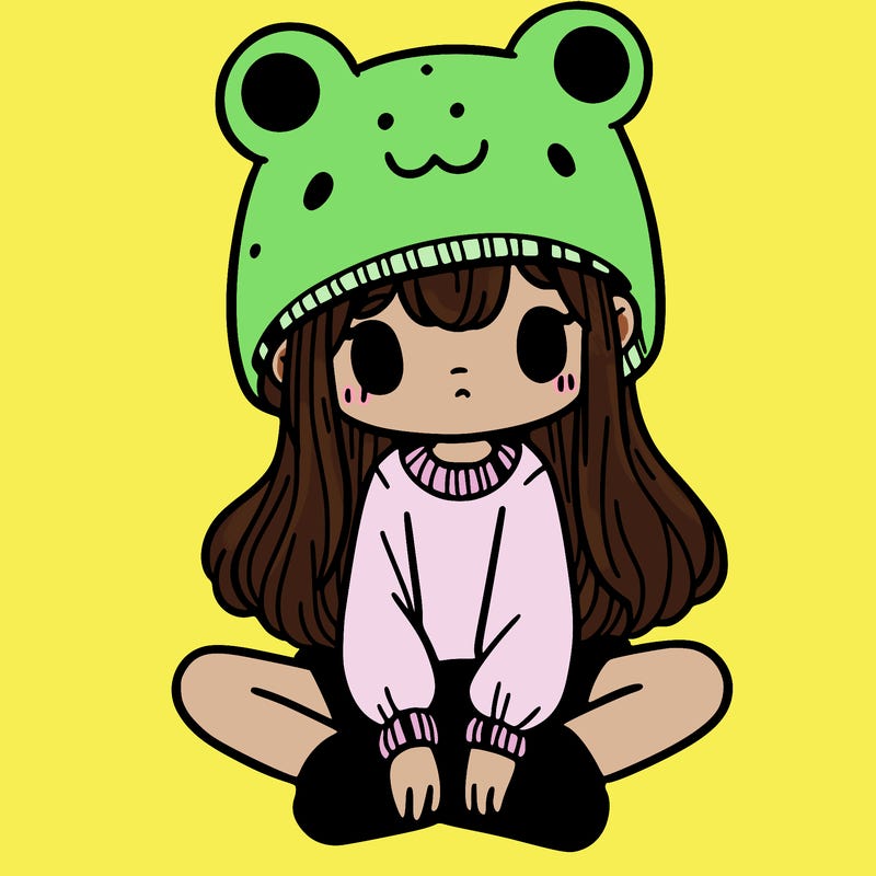 a girl wearing a frog hat and some frog socks