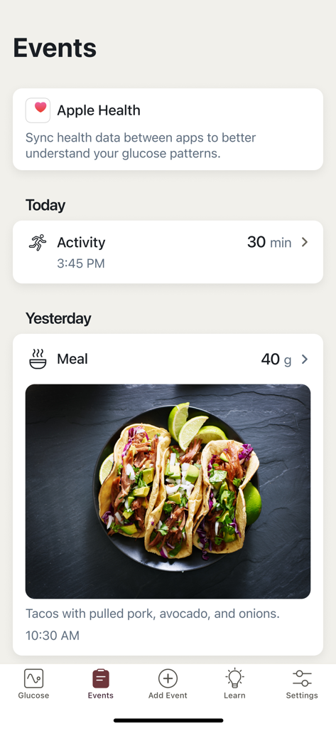 Stelo by Dexcom - Der Bildschirm 'Ereignisse' der Stelo by Dexcom App zeigt Aktivitätsprotokolle und eine erfasste Mahlzeit mit Schweinefleisch-Tacos