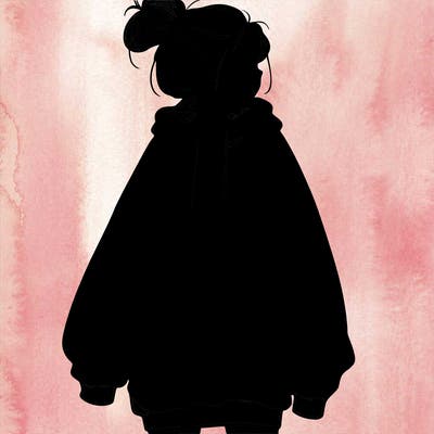 realistic girl with a oversized sweatshirt on and a bun