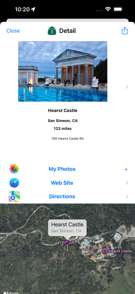Captura de pantalla de la aplicación Pacific Coast Highway que muestra detalles del Castillo Hearst con una foto de la Piscina de Neptuno y un mapa de la ubicación