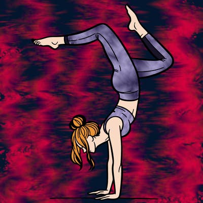 a woman doing a handstand