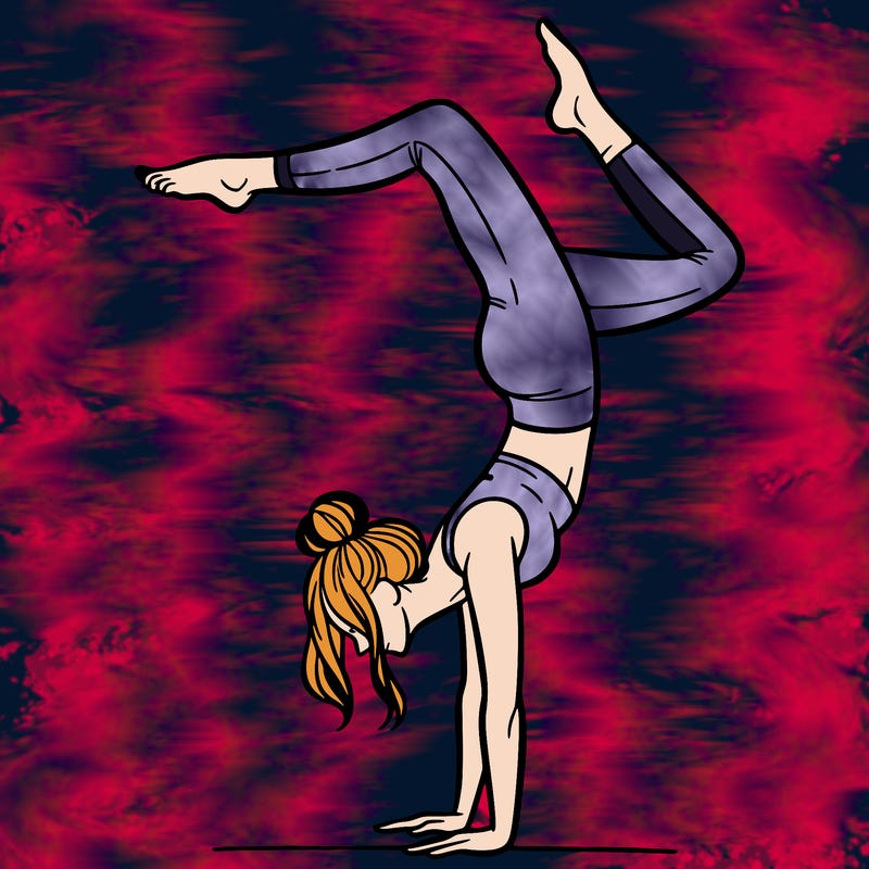 a woman doing a handstand