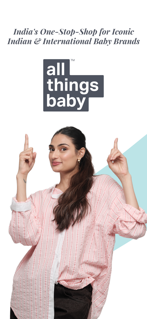 A woman pointing at the AllThingsBaby logo on a promotional screen for curated international baby brands