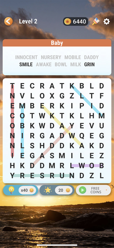 Word Search - Find Hidden Word - Una pantalla de juego de puzle de sopa de letras con temática de bebé y un fondo de atardecer.