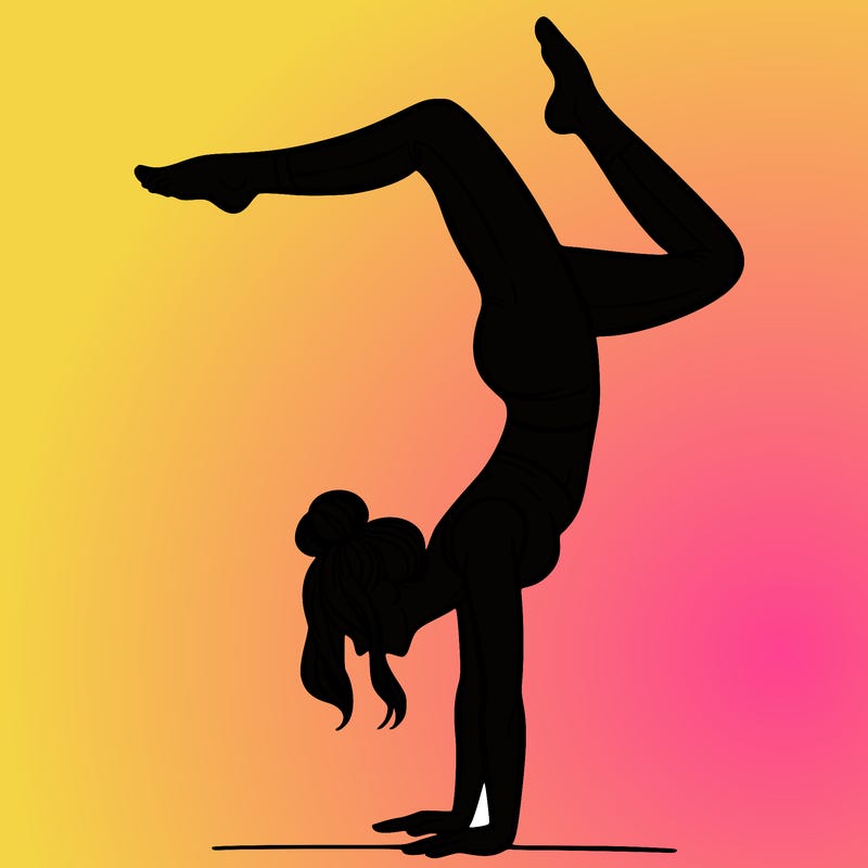 a woman doing a handstand