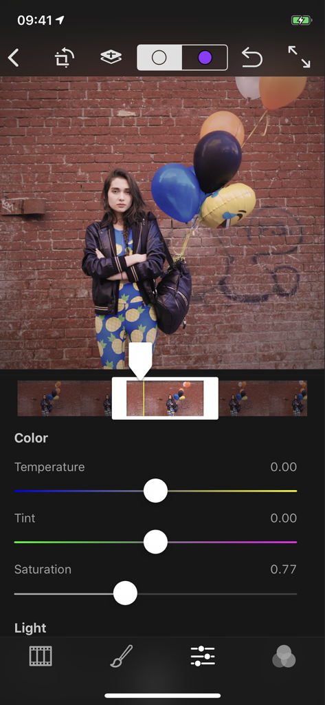 Interface of the Cinemagraph Pro app showing professional color editing sliders for temperature tint and saturation