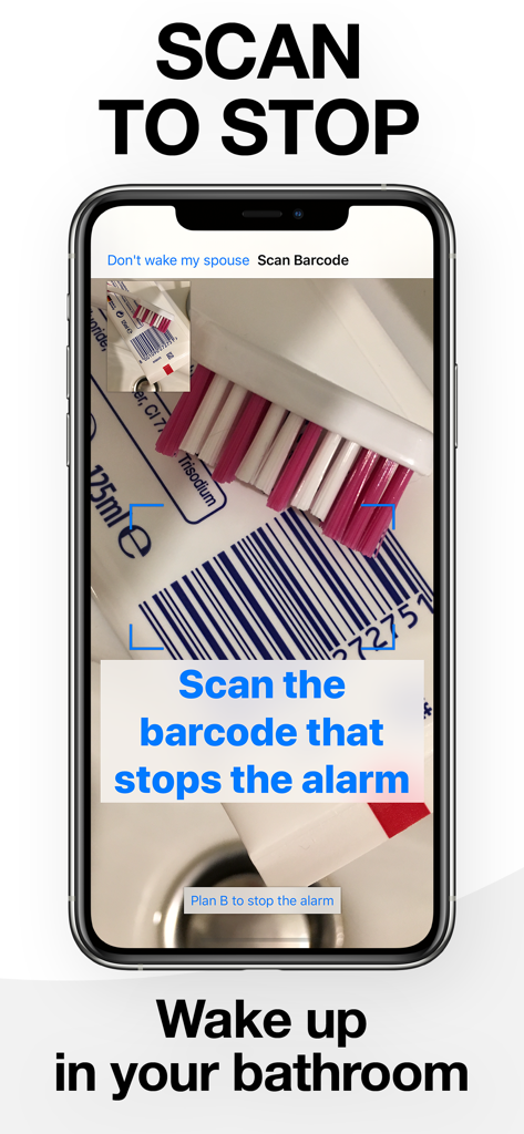 Tela do smartphone mostrando o aplicativo Despertador de Código de Barras escaneando o código de barras de um tubo de pasta de dentes para parar o alarme em um banheiro