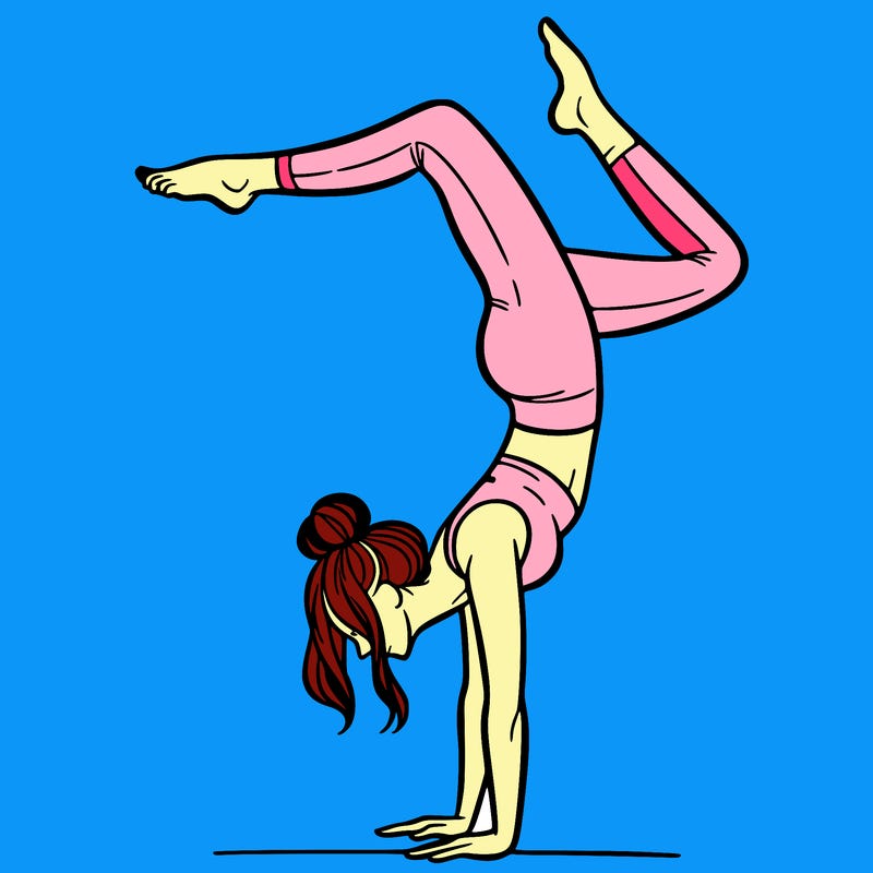 a woman doing a handstand