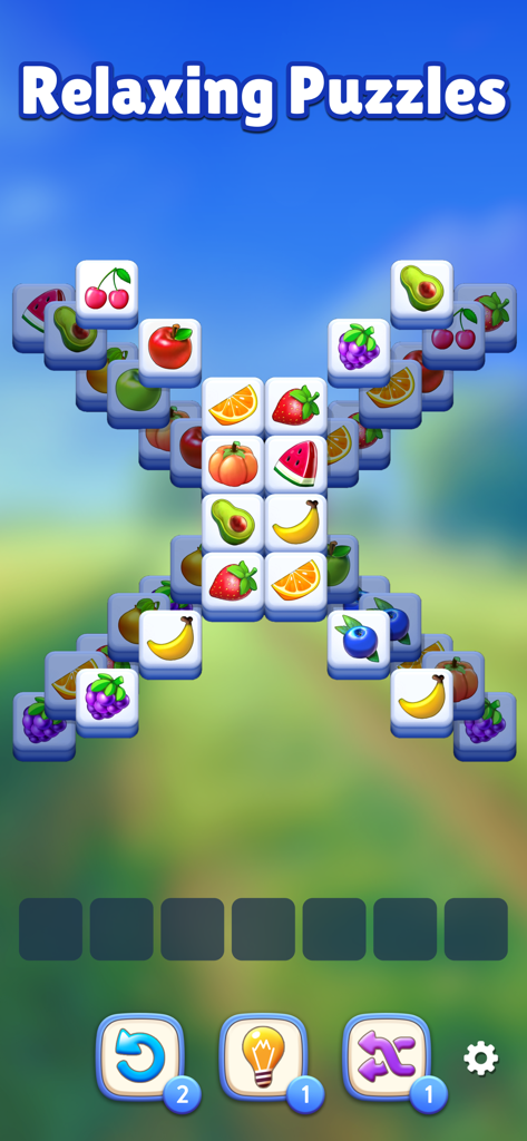 Fruit Match gameplay screenshot showing colorful 3D fruit tiles in a relaxing puzzle layout
