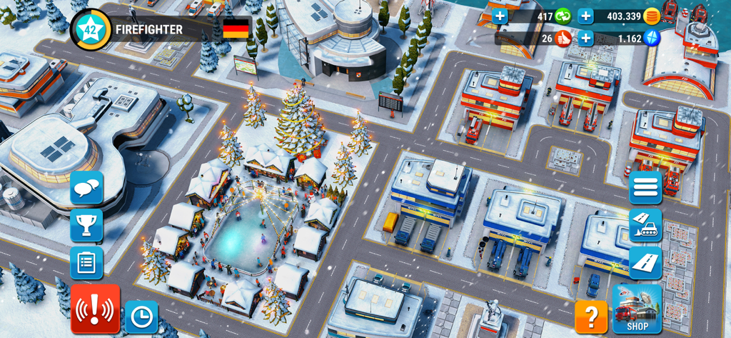 EMERGENCY HQ: firefighter game - Vue aérienne d'un centre de secours d'urgence décoré sur le thème de l'hiver, avec des postes de secours et des véhicules.