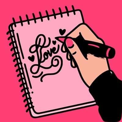 a hand writing “love” in calligraphy on a notebook