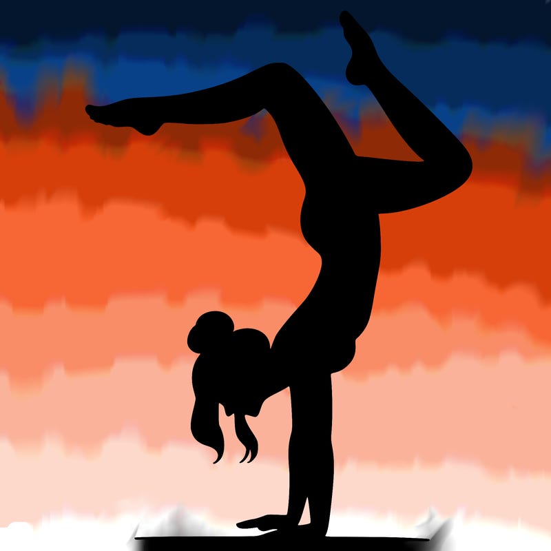 a woman doing a handstand