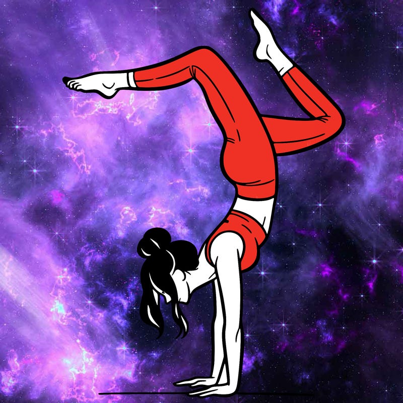 a woman doing a handstand