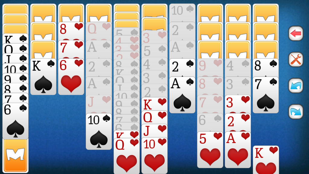 In-game screen showing a classic Spider Solitaire match with cards in columns on a blue background