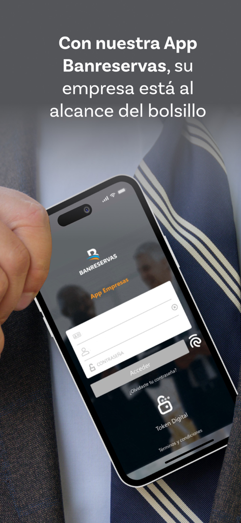 Business professional holding a smartphone showing the Banreservas Empresas app login screen.