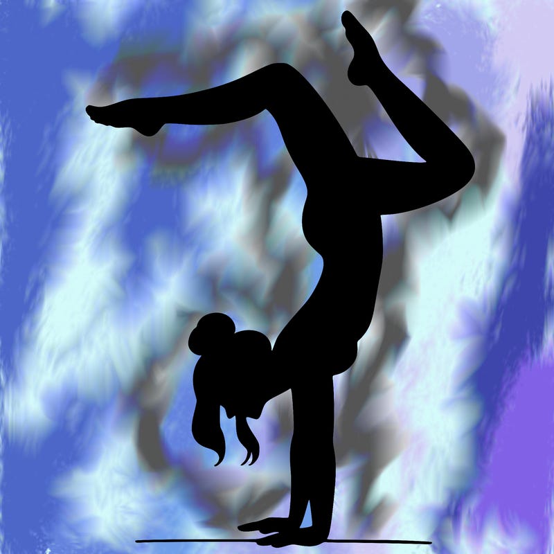 a woman doing a handstand