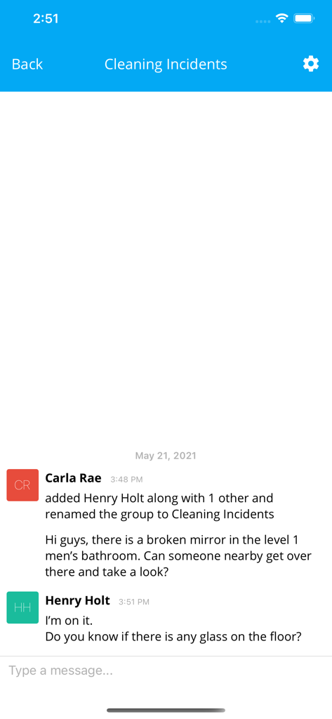 A messaging interface within the Lighthouse.io app showing two workers discussing a broken mirror incident in a bathroom.