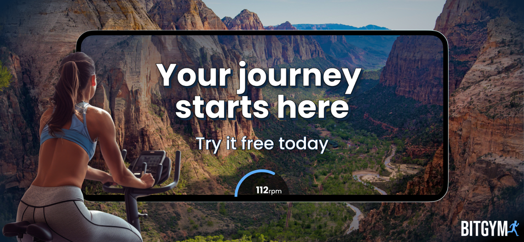 Woman on a stationary bike using the BitGym app to cycle through a virtual canyon landscape