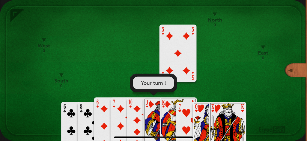 Hearts - Jogabilidade do jogo de cartas Copas mostrando a mão do jogador e a mesa em um fundo clássico de feltro verde.