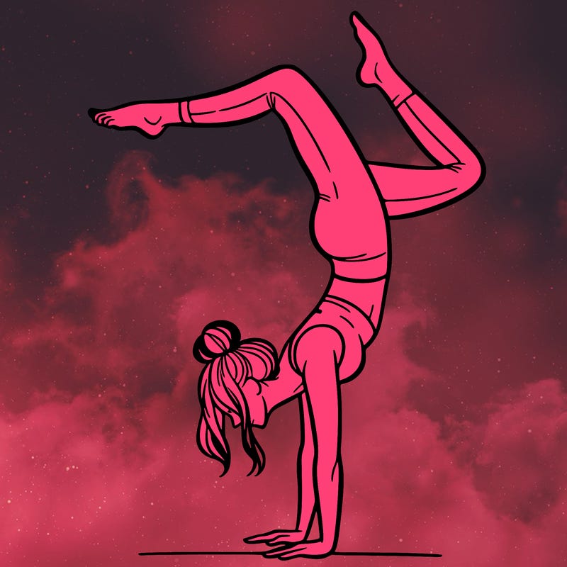 a woman doing a handstand